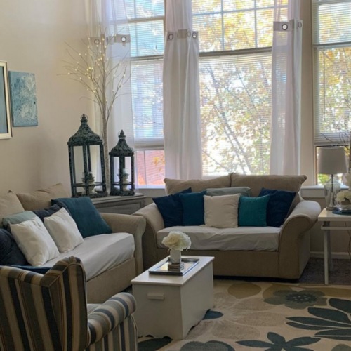 Settle into comfort at City View Apartments a living room with a large window