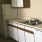 a kitchen with white cabinets