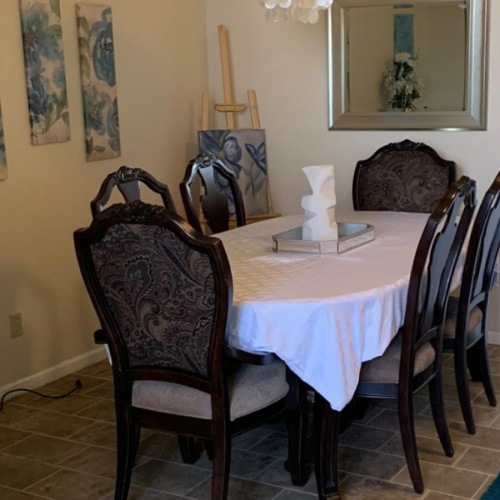 The essence of exceptional living a dining room with a table and chairs