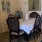 a dining room with a table and chairs
