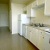 a kitchen with white cabinets