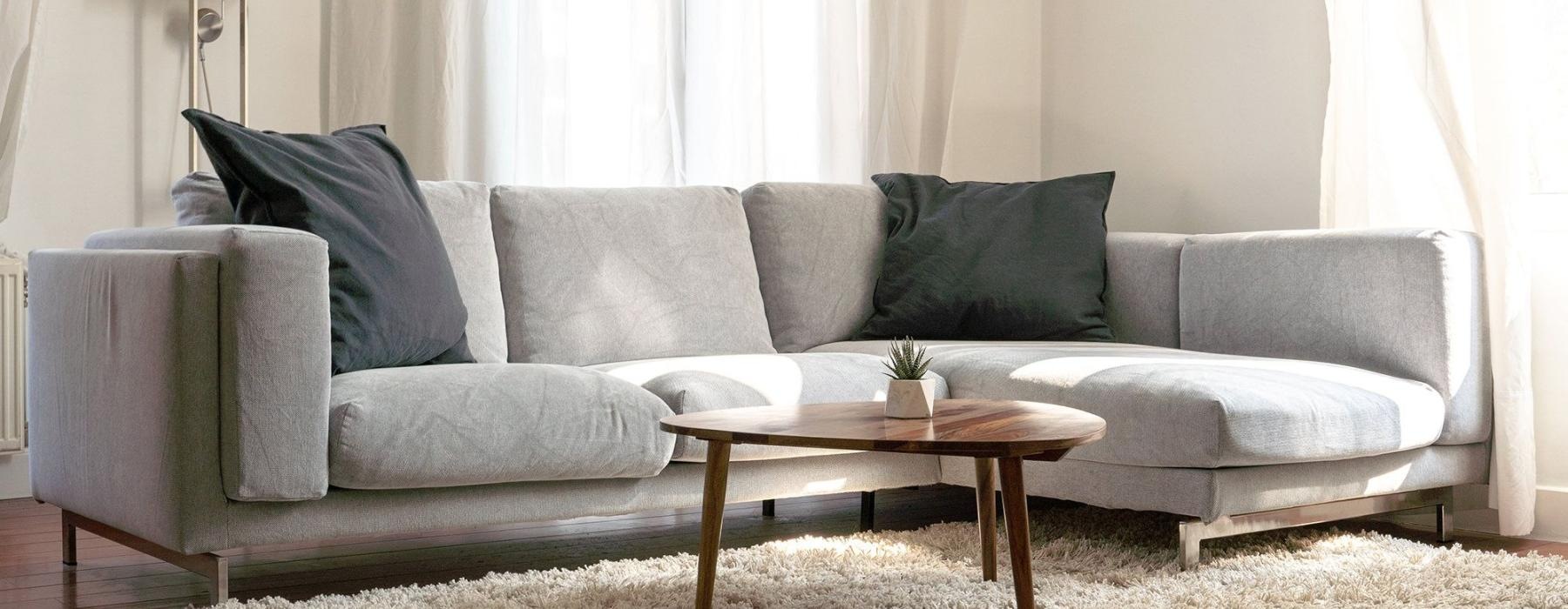 oversized windows brighten spacious, furnished living room