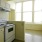 a kitchen with white cabinets