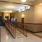 a hallway with a railing and a staircase