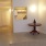 a room with a table and a mirror
